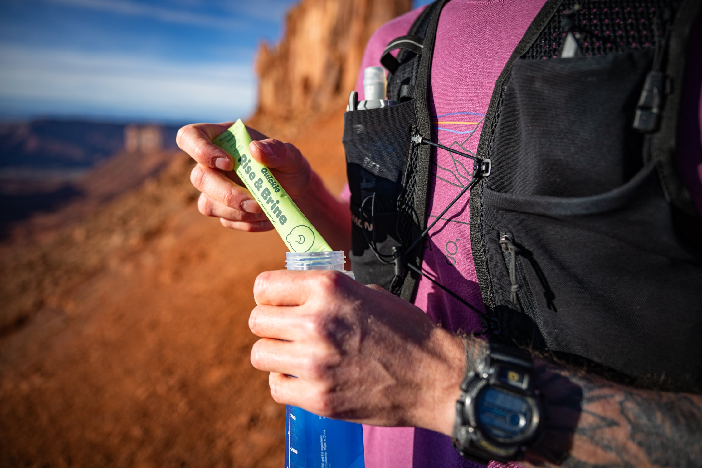 Tearing a Rise and Brine stick into a soft flask mid-run on a canyon ridge