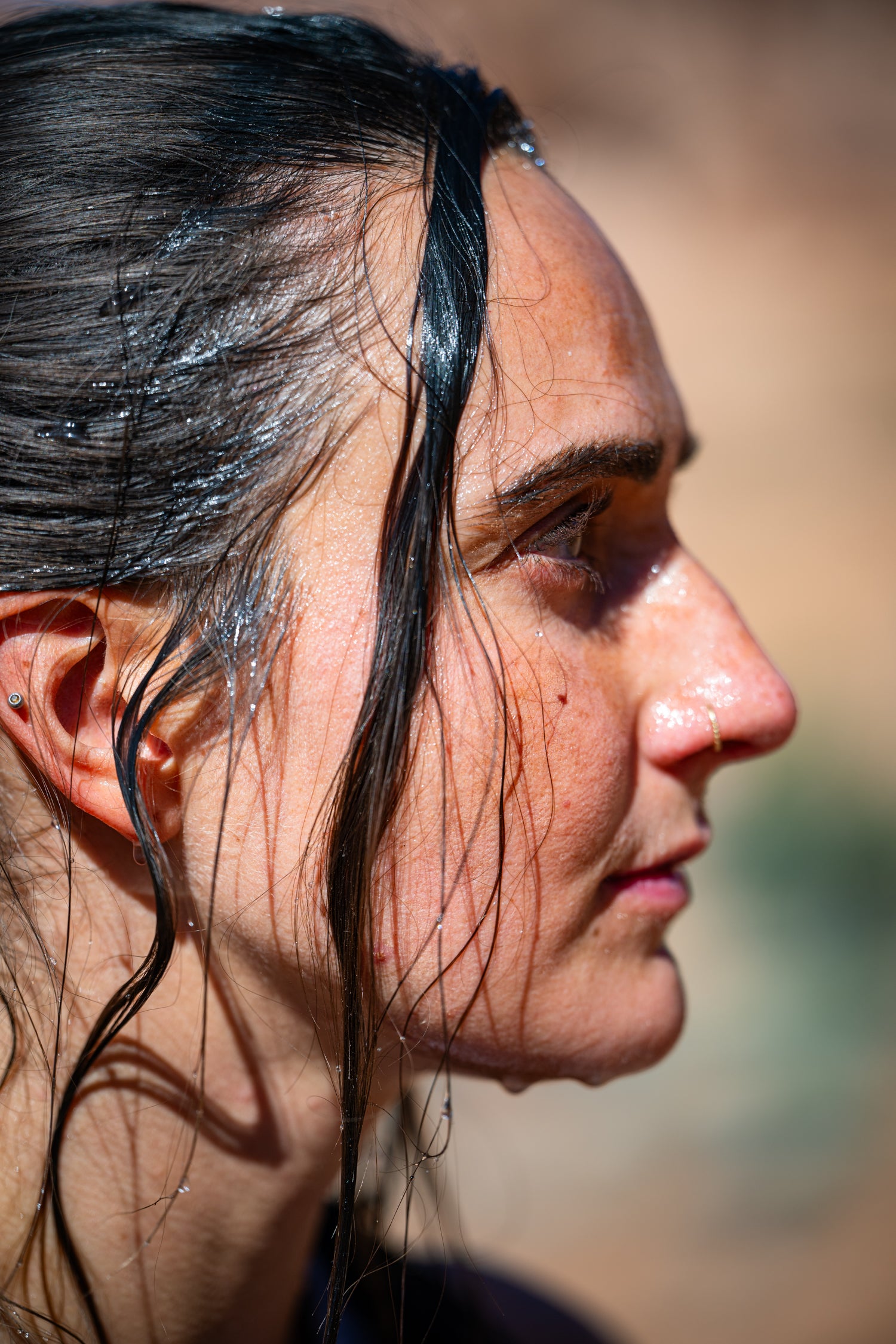 Endurance athlete with sweat-covered face after a hard effort