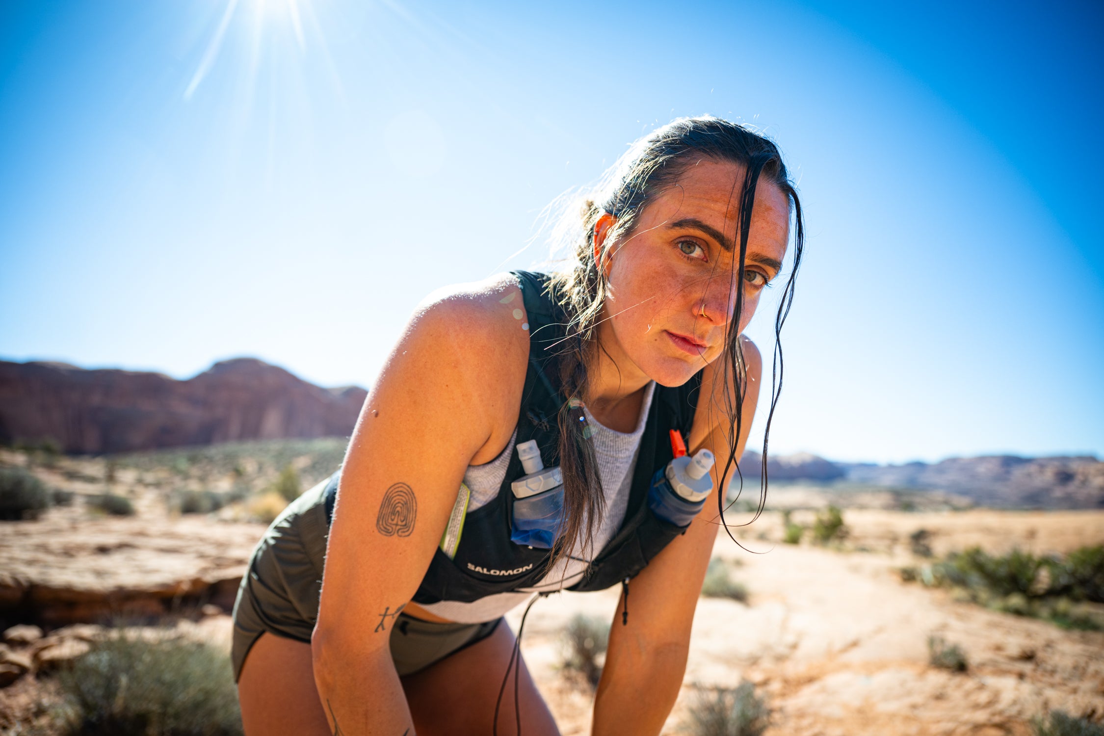 Maddie B. catching her breath on a desert run near Moab